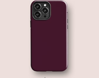 May include: A solid deep burgundy smartphone case with a smooth matte finish. The case features a square camera cutout in the top left corner containing three circular lenses and a flash. The text Acaso. is printed below the phone case.