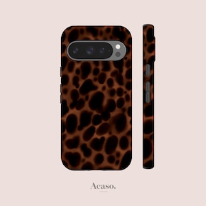 May include: A smartphone case featuring a brown and black tortoiseshell pattern. The case displays a horizontal camera cutout with multiple lenses and a flash. The side view shows integrated buttons and a slim profile. The text Acaso. London is visible.