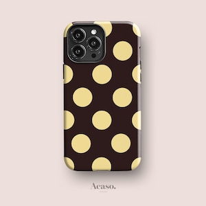 May include: A phone case with a dark brown background and a pattern of large, evenly spaced yellow polka dots. The case has a camera cutout and the brand name "Acaso" is printed at the bottom.