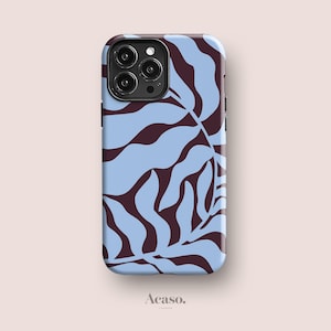 May include: A smartphone case featuring a repeating pattern of dark brown organic leaf shapes against a light blue background. The case has a cutout for a triple-lens camera system on the top left corner. The word Acaso. is printed below the case.
