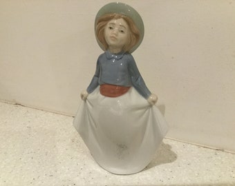 Lladro Nao Girl holding up skirt Curtsing..