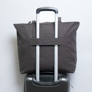 Handbag with trolley sleeve 2025