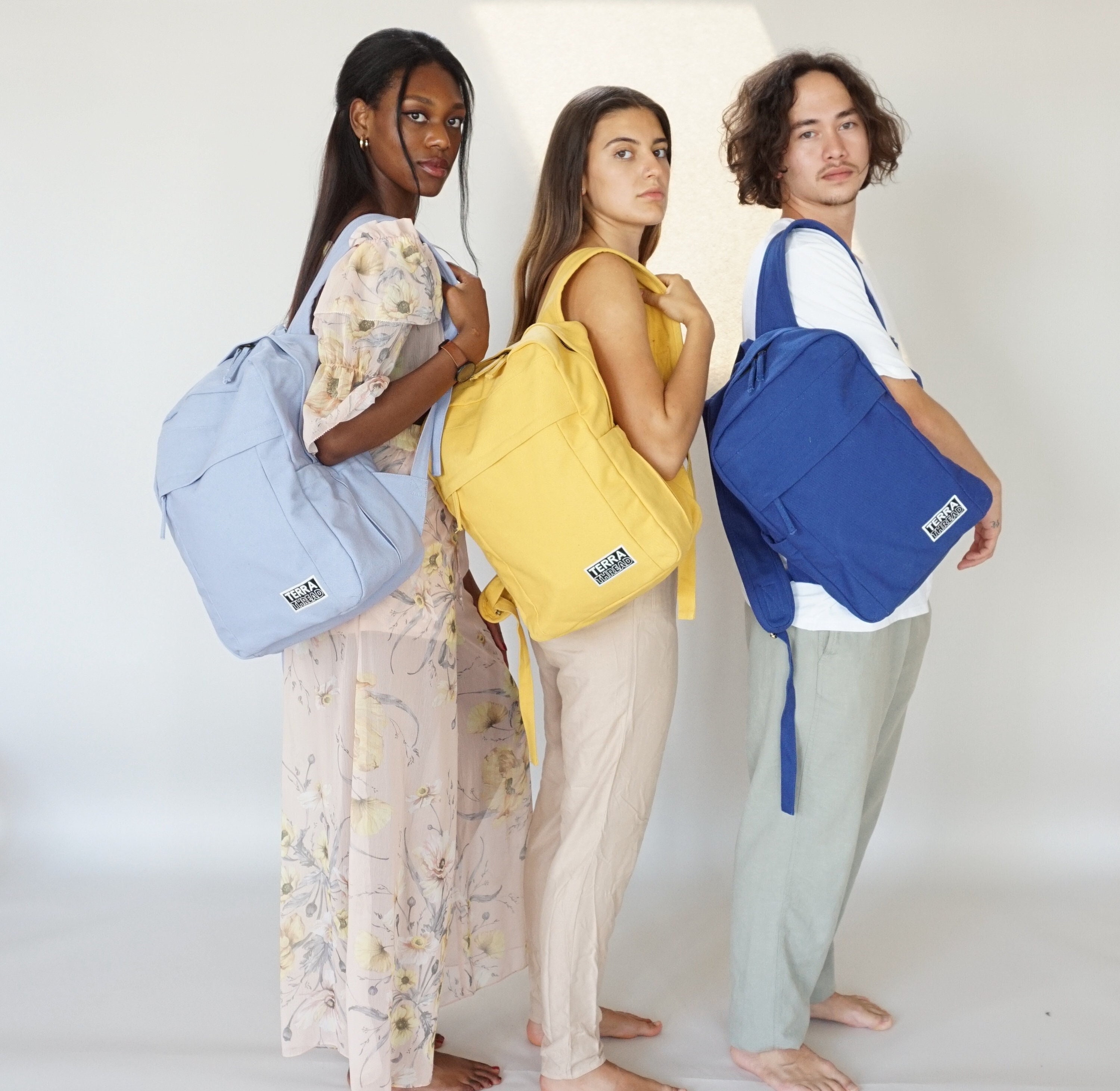 Women stay with Backpack with reusable water bottle in a pocket