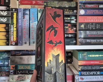 Fuego y sangre de George R. R. Martin (Edición negra) / Tapa dura, pintura en el canto, cantos pintados a mano de colección