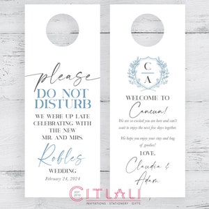 May include: White door hanger with blue text that says "Please Do Not Disturb" and "We were up late celebrating with the new Mr. and Mrs. Robles Wedding February 24, 2024". The other side of the door hanger has a blue monogram with the letters "C" and "A" and the text "Welcome to Cancun! We are so excited you are here and can't wait to enjoy the next few days together. We hope you enjoy your stay and bag of goodies! Love, Claudia & Adam".