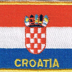 May include: A red, white, and blue embroidered patch with the Croatian coat of arms and the word "CROATIA" in yellow.