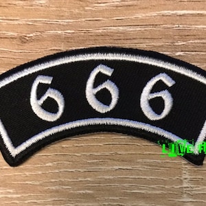May include: Black patch with a white embroidered border and the number 666 in white.