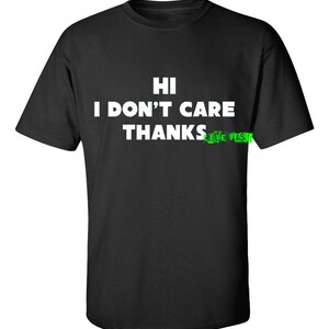 May include: Black t-shirt with white text that reads "HI I DON'T CARE THANKS LIVE FAST!"