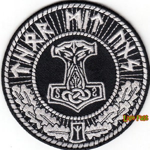 May include: Black and white embroidered patch with a stylized hammer and the text "Mjolnir" around the edge. The hammer is surrounded by a wreath of oak leaves and a stylized rune.