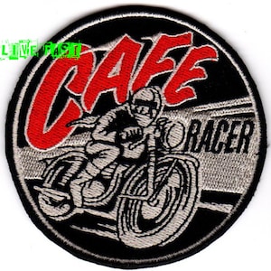 May include: A black and white embroidered patch with a red "Cafe Racer" design. The patch features a motorcycle rider in a helmet and a motorcycle with a large front tire.
