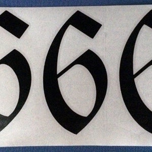 May include: Three black, stylised numbers '6' in a gothic font on a white background.