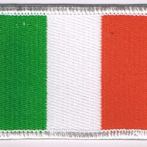 May include: A green, white, and red fabric patch with a stitched border. The patch features the colors of the Italian flag.