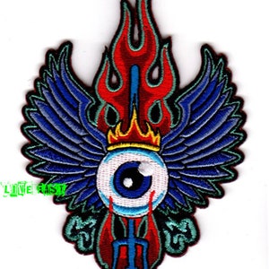 May include: Embroidered patch featuring a blue eye with a red crown and flames, surrounded by blue wings and a trident.