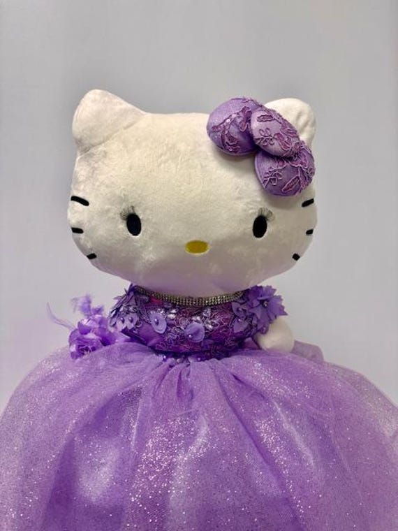 hello kitty purple dress Hello Kitty Fever , Mihika looked absolutely delightful in her lilac  dress adorned with a playful Hello Kitty print. , The soft cotton fabric  not only ensured her comfort but also added a touch of