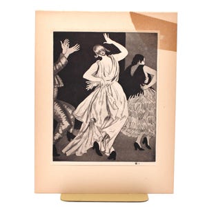 May include: Monochrome print depicting three dancers. The central figure is in a flowing white dress, arms raised. The other two figures are in the background, one in a patterned outfit and the other in a dark dress.