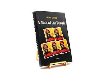 Un hombre del pueblo. Por Chinua Achebe. Primera edición americana, primera impresión. John Day Co. Nueva York, 1966.
