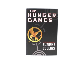 The Hunger Games. Warmly Inscribed by Suzanne Collins. First The Hunger Games. Warmly Inscribed by Suzanne Collins. First