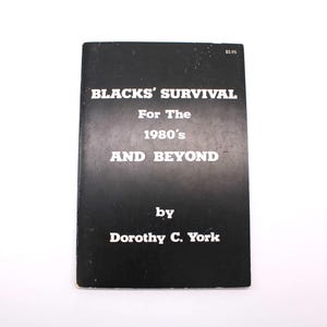 May include: A black book with the title "BLACKS' SURVIVAL For The 1980's AND BEYOND" by Dorothy C. York. The text is white, and a price tag is in the top right corner. The book is on a white background.