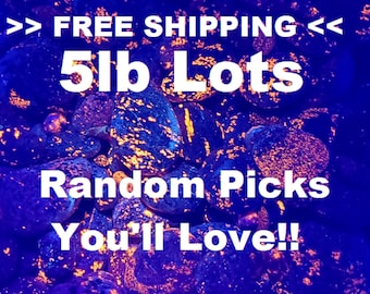 May include: A close-up image of a pile of 5 lb lots of colourful, iridescent rocks. The rocks are a mix of dark blue, purple, and black with bright orange and yellow flecks. The text "FREE SHIPPING" and "Random Picks You'll Love!!" is superimposed on the image.