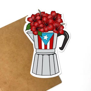 May include: A sticker featuring a silver coffee pot design with the Puerto Rican flag on the front. The coffee pot is filled with red hibiscus flowers and green leaves. The sticker is on a white background.