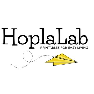 May include: Black and white logo for HoplaLab, a company that provides printables for easy living. A yellow paper airplane flies off to the right, leaving a dotted line trail.
