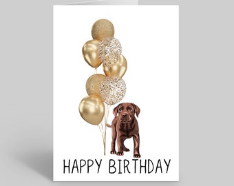 May include: A brown dog with a black nose and black eyes stands in front of a bunch of gold balloons with confetti. The balloons are tied together with a string. The text "HAPPY BIRTHDAY" is written in black below the dog.