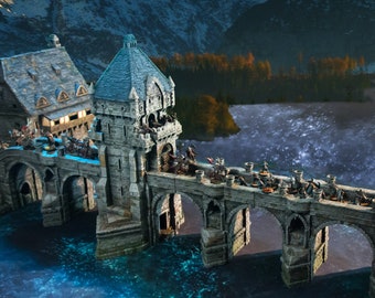 May include: A stone bridge with a tower on one side, crossing a river with a snowy mountain range in the background. The bridge is decorated with small figures of people and animals.