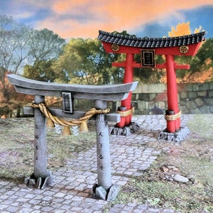 May include: Two traditional Japanese Torii gates, one red and one gray, with a rope and tassels hanging from the gray gate. The gates are set against a backdrop of trees and a stone wall.