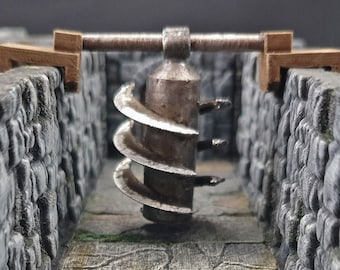 Pode incluir: Uma armadilha de masmorra de metal impressa em 3D com um mecanismo de lâmina rotativa. A armadilha é feita de plástico cinza e tem uma lâmina de metal que gira em um eixo de metal. A armadilha é montada em uma base de madeira.