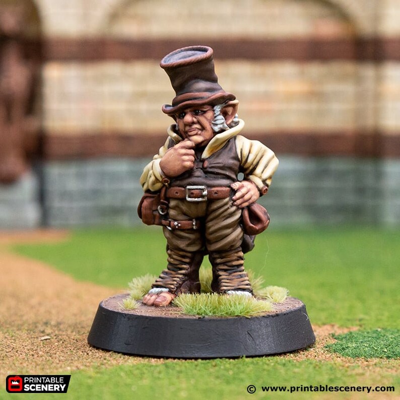 May include: A painted miniature figurine of a small, humanoid figure with pointed ears, wearing a brown top hat, brown vest, and brown pants. The figure is holding a small bag in one hand and has a thoughtful expression on its face.