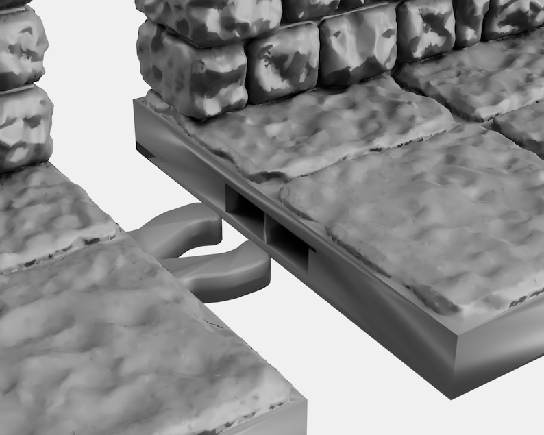 May include: Close-up of two gray stone wall sections with a connecting piece. The connecting piece has two slots and a gray plastic connector with two loops.