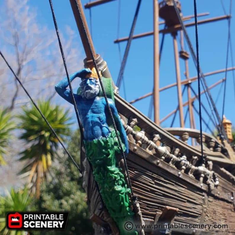 May include: A blue and green figurehead of a merman with a beard, holding a seashell, is attached to the side of a wooden ship. The ship is made of wood and has a weathered look. The figurehead is a decorative element that is often found on ships.