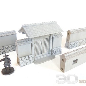 May include: A set of grey 3D printed miniature Japanese style wall sections and a gate with a slatted door. The wall sections have a stone base and a tiled roof. The gate has a tiled roof and a stone base.