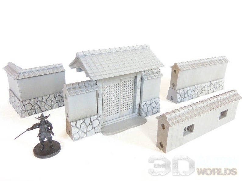 May include: A set of grey 3D printed miniature Japanese style wall sections and a gate with a slatted door. The wall sections have a stone base and a tiled roof. The gate has a tiled roof and a stone base.