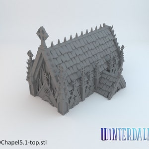 May include: A 3D printed model of a gothic chapel with a detailed roof and intricate stonework. The chapel has a pointed arch doorway and a cross on the roof. The model is gray and has a textured surface.