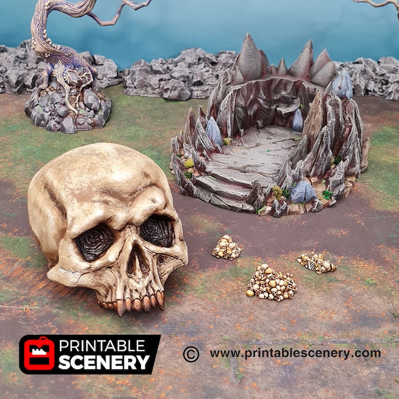 May include: A 3D printed cave entrance with a skull and piles of gold coins. The cave entrance is made of gray and brown plastic and has a rough texture. The skull is white and has a realistic appearance. The gold coins are scattered on the ground.