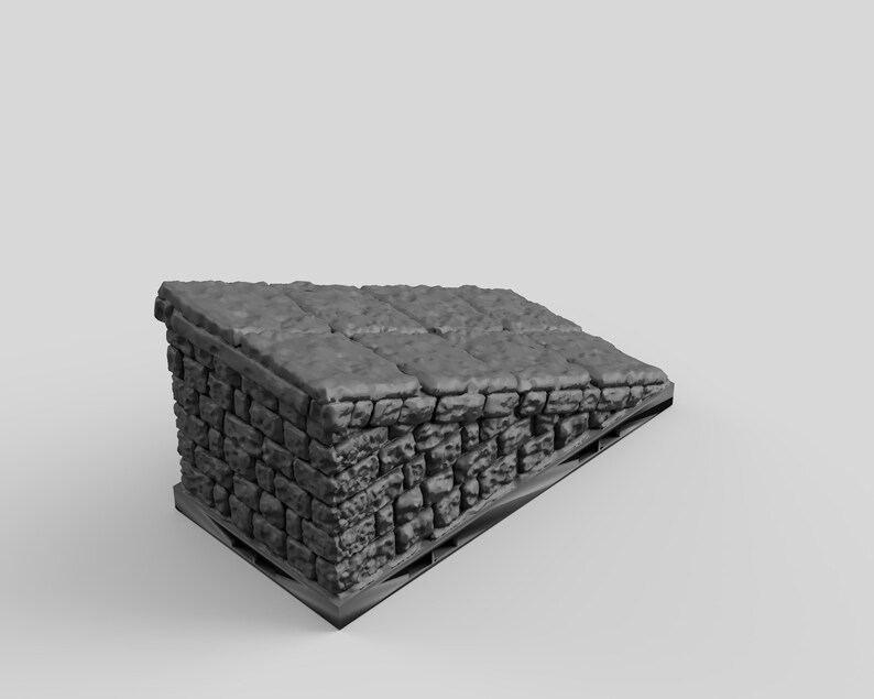 May include: A gray stone wall with a flat, tiled roof. The wall is made of rough-hewn stones and is angled slightly. The roof is made of flat, square tiles. The wall is on a wooden pallet.