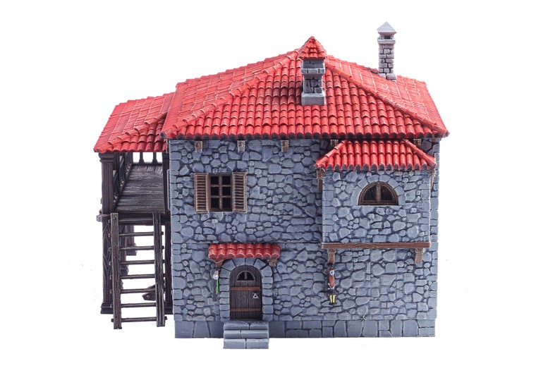 May include: A miniature stone house with a red tiled roof, a wooden balcony, and a ladder leading up to it. The house has a door, two windows, and a small arched window.