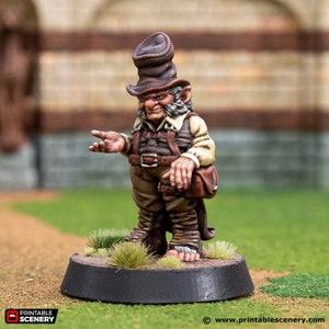 May include: A miniature figurine of a gnome wearing a brown hat and a brown vest. The gnome is standing on a small, round base with green grass.