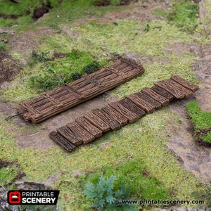 May include: Two wooden bridges made of planks, one with a lattice design, on a grassy surface. The bridges are brown and weathered, and the grass is green. The image is from Printable Scenery, a website that sells printable scenery for tabletop games.