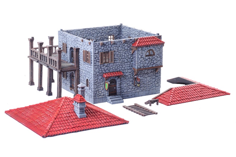 May include: A grey stone building with a red tiled roof, a wooden balcony, and a ladder. The building is a miniature model for tabletop gaming.