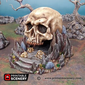 May include: A 3D printed miniature skull cave with a detailed skull and rocky exterior. The cave entrance is filled with small, white bones.
