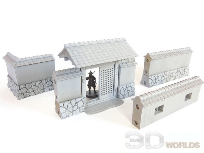 May include: A set of five gray plastic miniature castle walls with a gate and a roof. The walls are made to look like stone and have a textured surface. The gate has a wooden door with a lattice design. The roof is made of tiles and has a slight curve. The walls are designed for use in tabletop games and role-playing games.