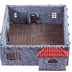 May include: A miniature stone building with a red tiled roof, a wooden door, and windows. The interior is visible and has a wooden floor.
