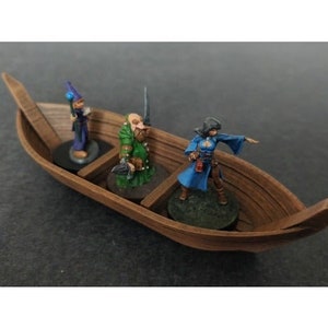 May include: Three miniature figures, a wizard, a warrior, and a sorceress, are riding in a wooden rowboat. The wizard is wearing a blue and white robe, the warrior is wearing green armor, and the sorceress is wearing a blue and white dress. The rowboat is made of wood and has a brown finish.