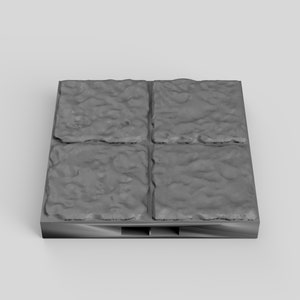 May include: A set of four gray stone tiles with a textured surface. The tiles are arranged in a 2x2 grid and are mounted on a black base.