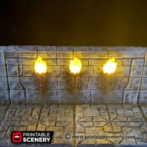 May include: Three wall-mounted torch sconces with lit flames, set against a stone wall backdrop. The sconces are made of a dark metal and have a simple design. The flames are a bright yellow color and cast a warm glow.
