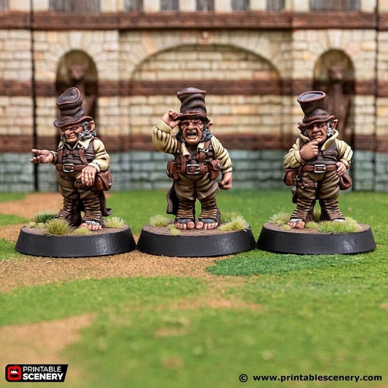 May include: Three miniature figures of goblins wearing brown top hats and brown jackets. The goblins are standing on black bases with green grass around them.