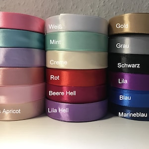 May include: A collection of 18 satin ribbon spools in various colors, including pink, turquoise, white, mint, gold, gray, lavender, cream, black, light pink, red, purple, burgundy, light pink, blue, peach, light purple, and navy blue.