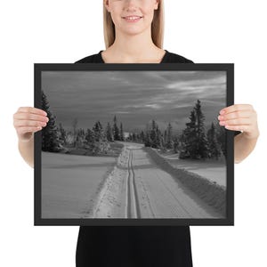 Framed poster skiing alone in winter